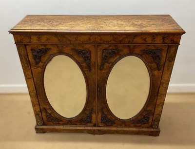 Lot 673 - A 19th century burr walnut cabinet with oval...