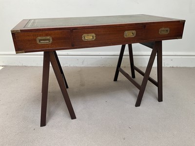 Lot 1133 - A reproduction brass bound campaign style twin...