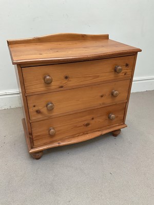 Lot 1043 - A modern pine serpentine fronted chest of...