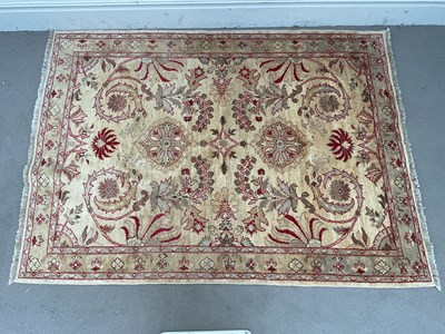 Lot 1408 - A cream coloured rug