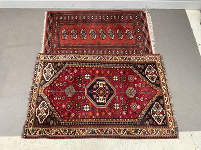 Lot 1409 - Two red ground rugs (2)