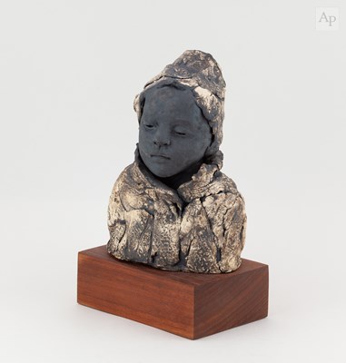 Lot 632 - A stoneware sculpture of a female head and...