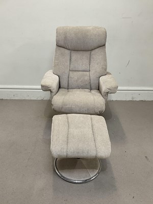 Lot 1104 - A recloning swivel chair with stool on chrome...