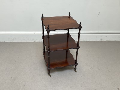 Lot 1294 - A Victorian mahogany three tier whatnot on...