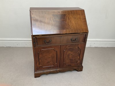 Lot 1132 - A reproduction mahogany bureau, height 101cm,...