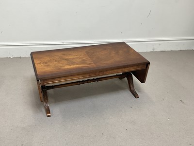Lot 1113 - A reproduction mahogany drop-leaf coffee table,...