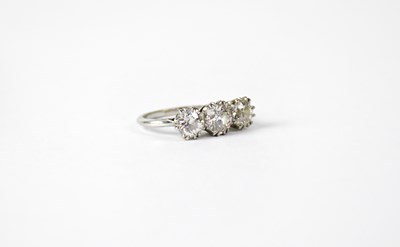 Lot 919 - A platinum ring set with three brilliant cut...