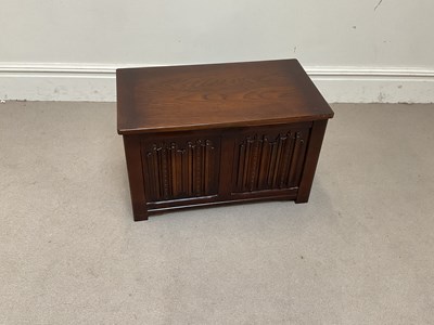 Lot 1129 - A reproduction Priory style blanket chest,...