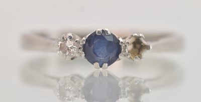 Lot 1285 - An 18ct white gold sapphire and diamond set...