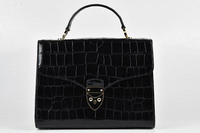 Lot 1395 - ASPINAL; a black embossed crocodile leather...