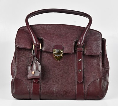 Lot 1393 - ASPINAL; a grained mulberry red leather...