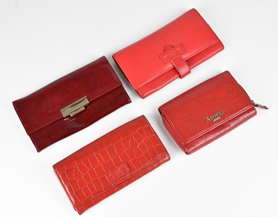 Lot 1426 - Four leather wallet purses comprising an...