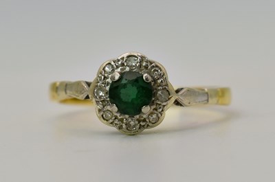 Lot 472 - An 18ct gold and green stone cluster ring,...