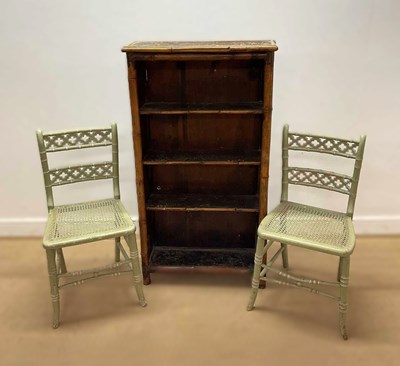 Lot 686 - A faux bamboo bookshelf with four shelves with...