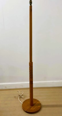 Lot 638 - A mid 20th century teak floor lamp, height 141cm.