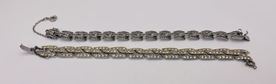 Lot 574 - A costume jewellery bracelet with white stones,...