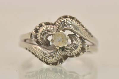 Lot 1284 - An 18ct white gold white stone set dress ring,...