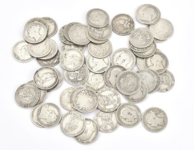 Lot 561 - A collection of fifty-five silver shillings,...