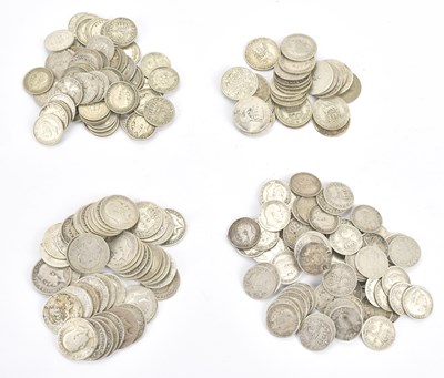 Lot 608 - A collection of silver six pence pieces and...