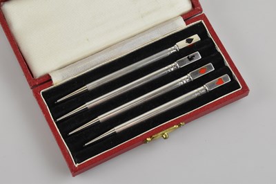 Lot 147 - A cased set of four sterling silver bridge...