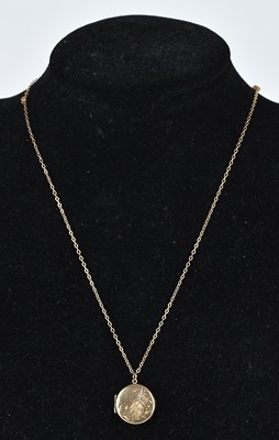Lot 306 - A 9ct yellow gold locket with engraved detail,...