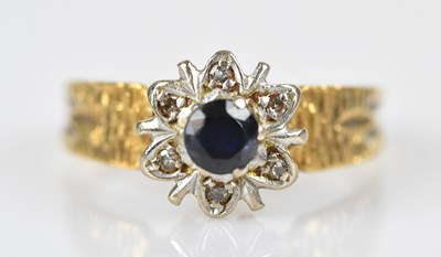 Lot 444 - An 18ct yellow gold diamond and sapphire...