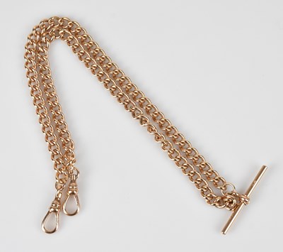 Lot 1096 - A 9ct rose gold flat link Albert chain and...