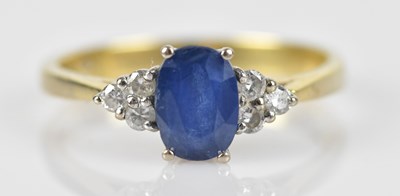 Lot 424 - An 18ct yellow gold diamond and sapphire dress...