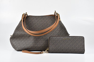 Lot 1418 - MICHAEL KORS; a coated canvas monogram Raven...