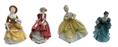 Lot 533 - ROYAL DOULTON; four assorted porcelain figures...