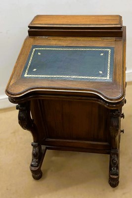 Lot 663 - A 19th century mahogany Davenport with leather...