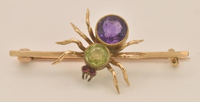 Lot 1404 - A 15ct yellow gold peridot, amethyst and ruby...