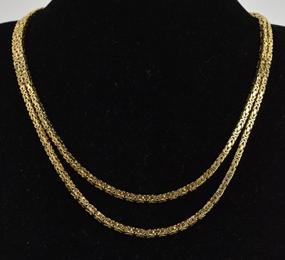 Lot 1346 - An 18ct yellow gold long guard box link...