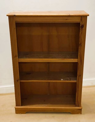 Lot 695 - A pine open three shelf bookcase, height 122cm,...
