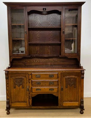 Lot 661 - An early 20th century oak dresser with glazed...