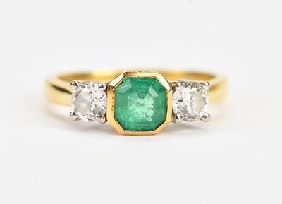 Lot 398 - An 18ct yellow gold diamond and emerald three...
