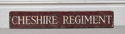 Lot 1043 - A Cheshire Regiment wooden sign, 12 x 74cm.