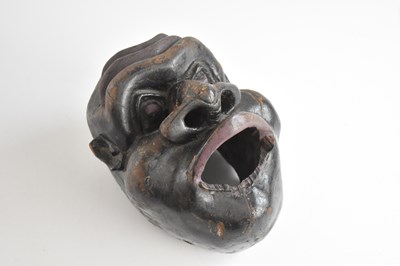 Lot 392 - An unusual carved hardwood face mask, possibly...