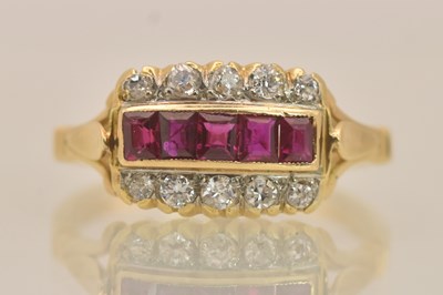 Lot 1283 - An 18ct yellow gold ruby and diamond set...