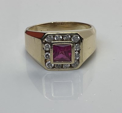 Lot 539 - A 14ct gold dress ring with square cut ruby...