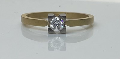 Lot 560 - An 18ct matte gold diamond solitaire ring,...