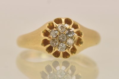 Lot 1305 - An 18ct yellow gold diamond set cluster signet...