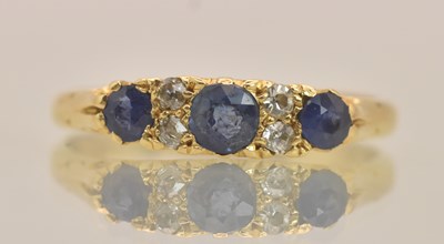 Lot 1306 - An 18ct yellow gold sapphire and diamond set...