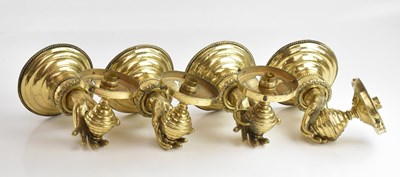 Lot 2239 - Four modern brass wall lights in the form of...