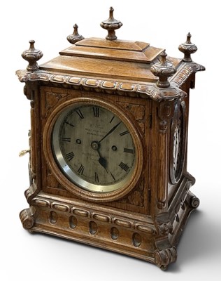 Lot 142 - W M PAGE; a late 19th century carved oak...