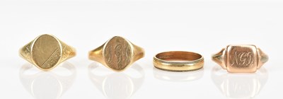 Lot 399 - Three 9ct yellow gold signet rings, sizes U, T...