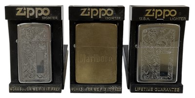 Lot 309 - ZIPPO; three boxed lighters comprising two...