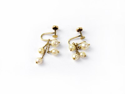 Lot 1040 - A pair of 14ct yellow gold screw back earrings,...