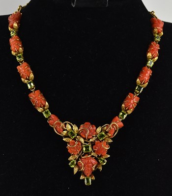 Lot 1348 - An Indian yellow metal carved coral and...