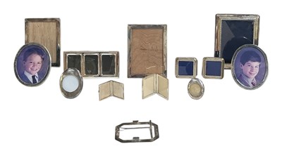 Lot 1211 - A pair of oval sterling silver framed easel...